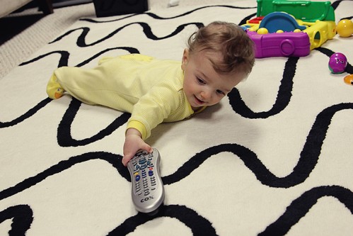 baby boy reaching for tv remote