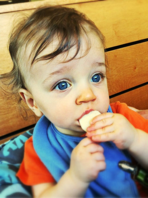 Teething baby eating Mum Mum