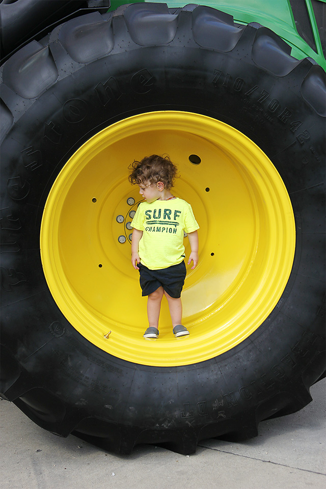 toddler inside tractor wheel at iowa state fair