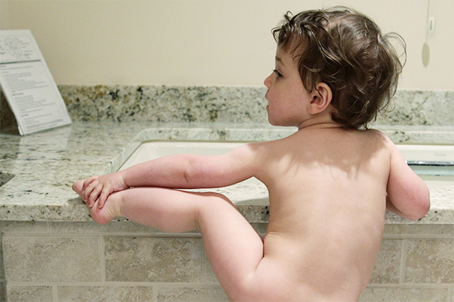 toddler climbing into bath tub on www.bunnyanddolly.com
