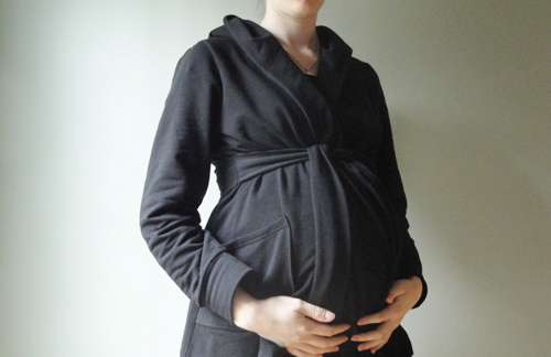 26 weeks, 5 days pregnant wearing Old Navy sweatshirt