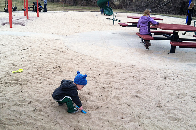 toddler playing in sand at playground | bunnyanddolly.com