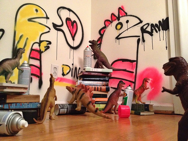 Dinovember - toy dinosaurs spray painting walls