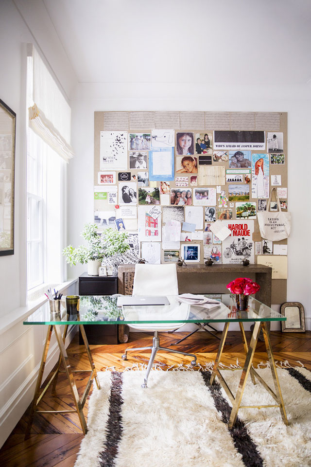 NYC brownstone desk with giant inspiration board