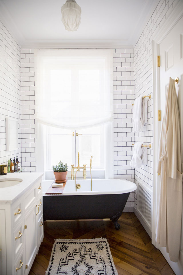 NYC brownstone bathroom with white subway tiles