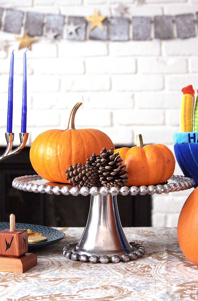 thanksgivukkah decorations with pumpkins and pinecones