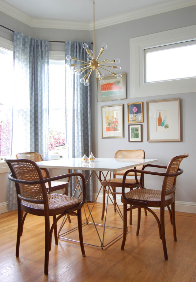 A mid-century modern Sputnik chandelier hangs over a table