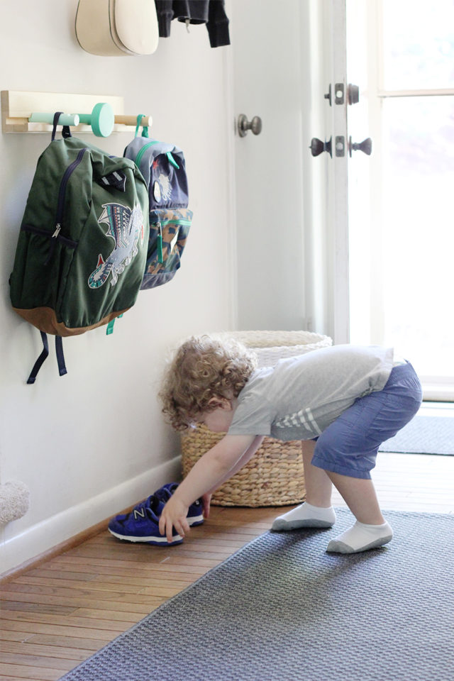 Set up a staging area near the front door for backpacks and shoes. That's one way to make mornings more manageable when school starts.
