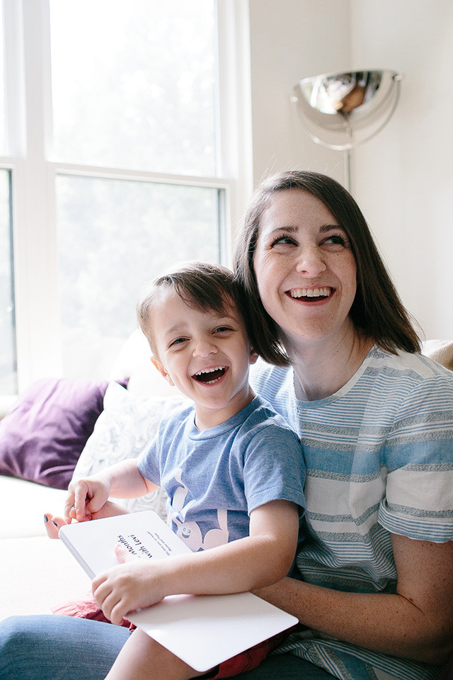 Mom and son reading baby photo book together | A Girl Named PJ Mom and son reading baby photo book together | A Girl Named PJ